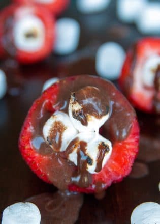 Smores Stuffed Strawberries. An easy dessert recipe that can be enjoyed around the campfire, bbq or all year long!