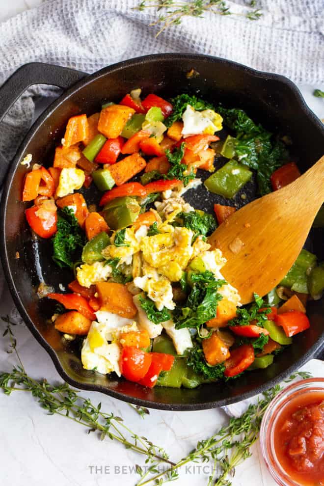 scrambled egg skillet with sweet potatoes, kale, and bell peppers