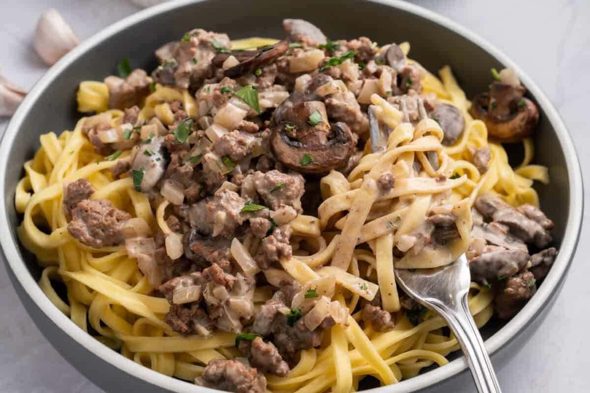 ground beef stroganoff on a plate with a fork