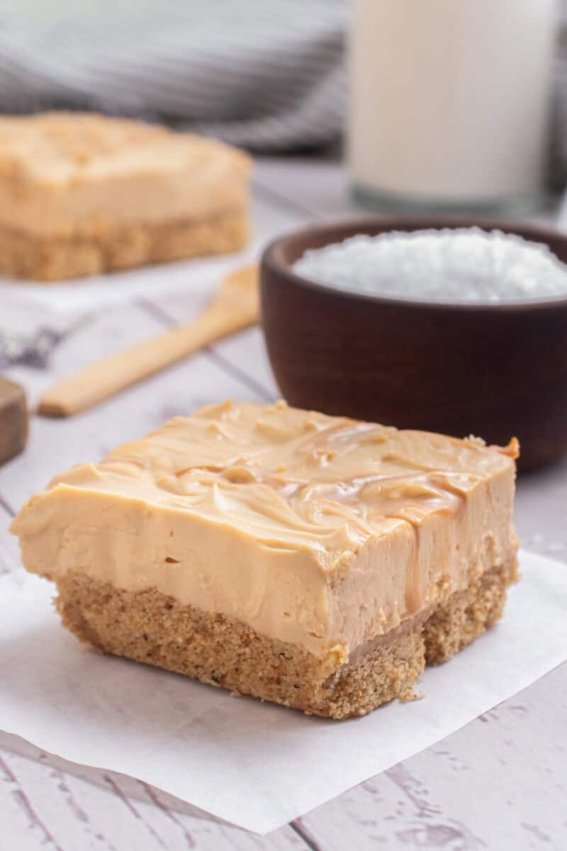 ducle de leche cheesecake with salt and milk in the background