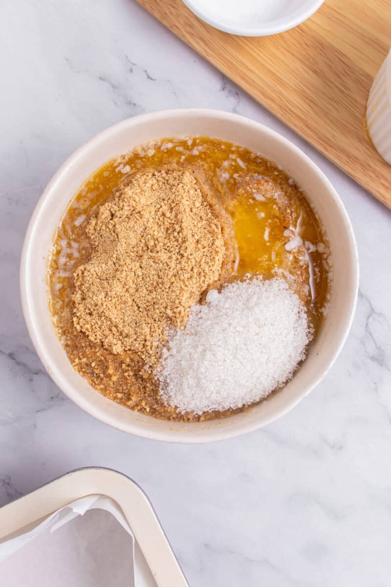 ingredients for dulce de leche cheesecake in a bowl