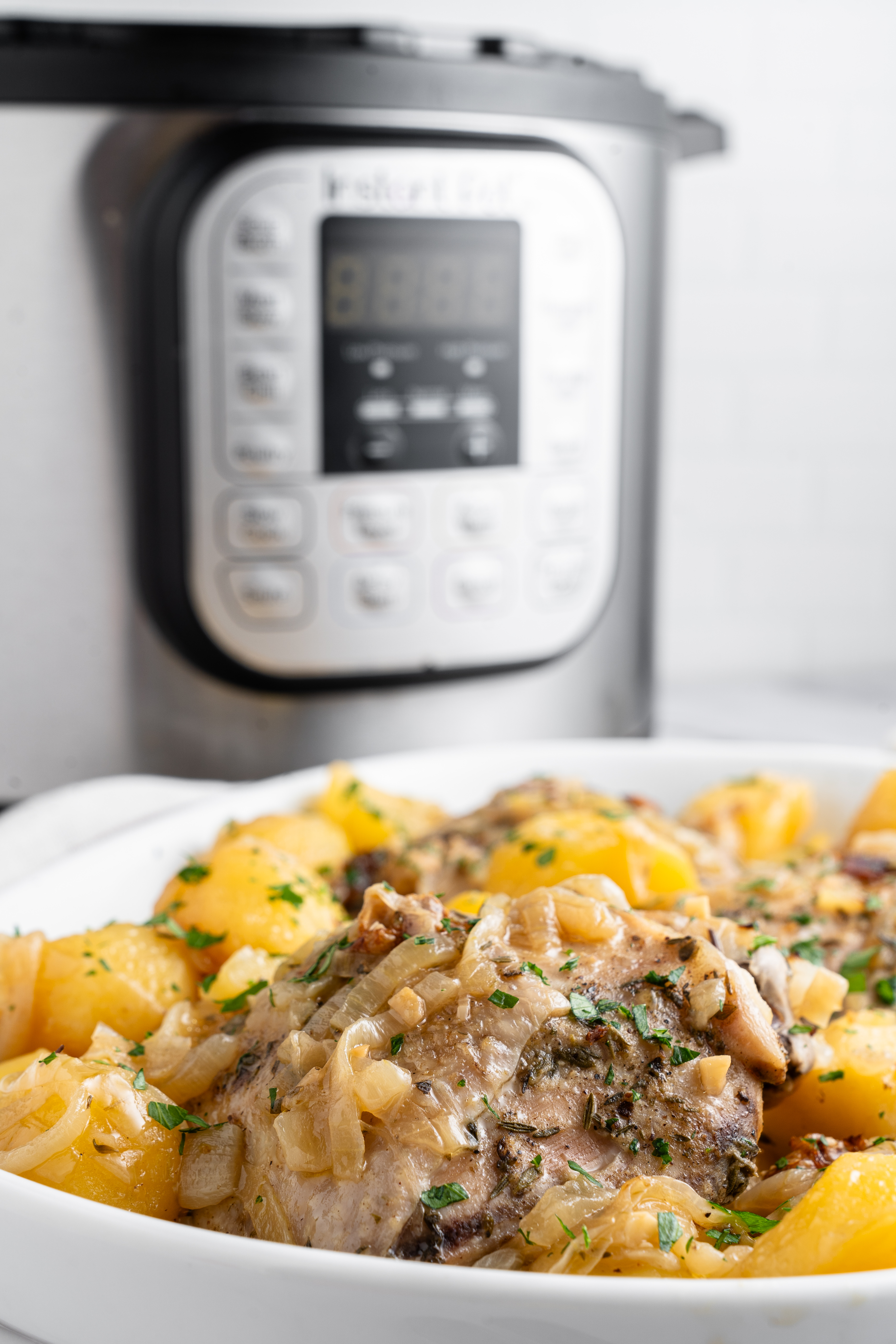 chicken and potatoes with an instant pot in the background