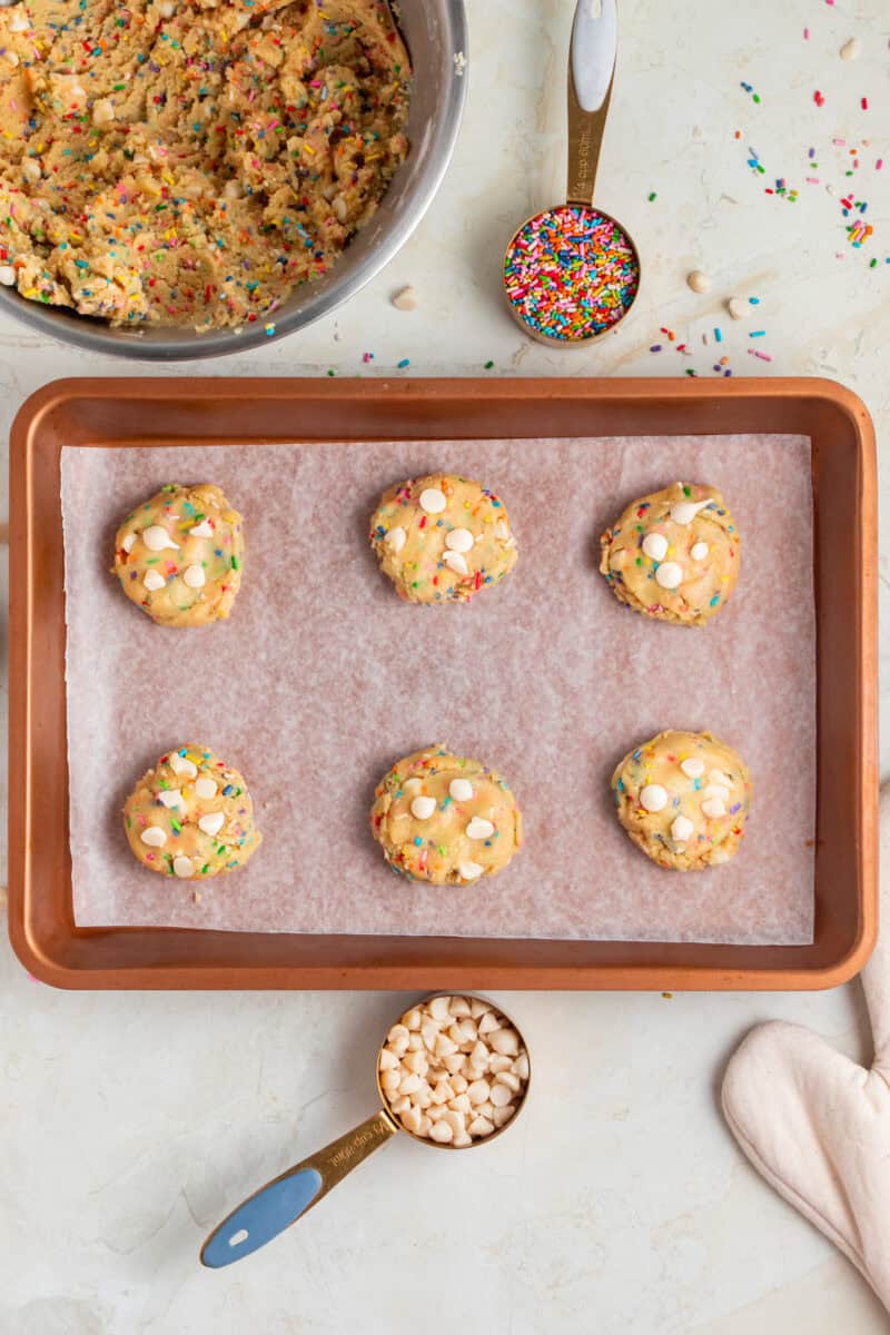 Birthday cake cookies on a baking sheet ready to bake