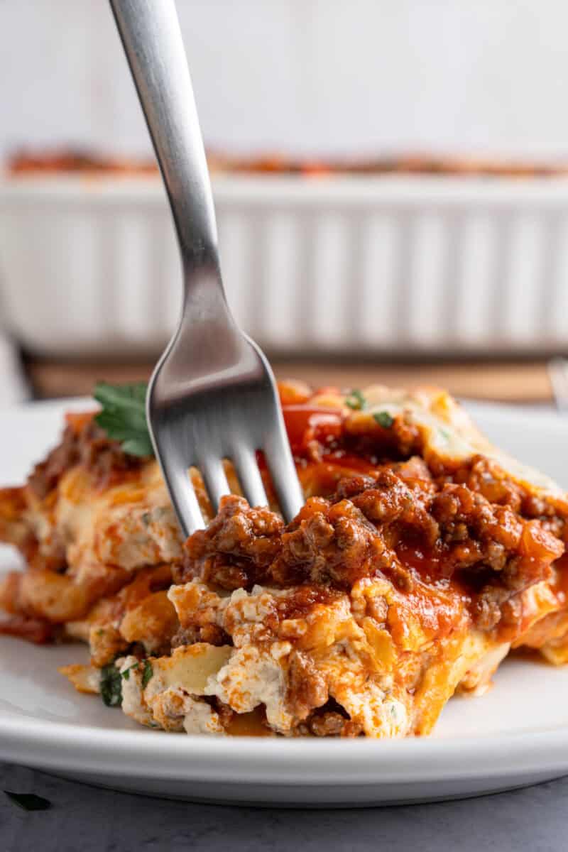 Lasagna casserole plated with a fork