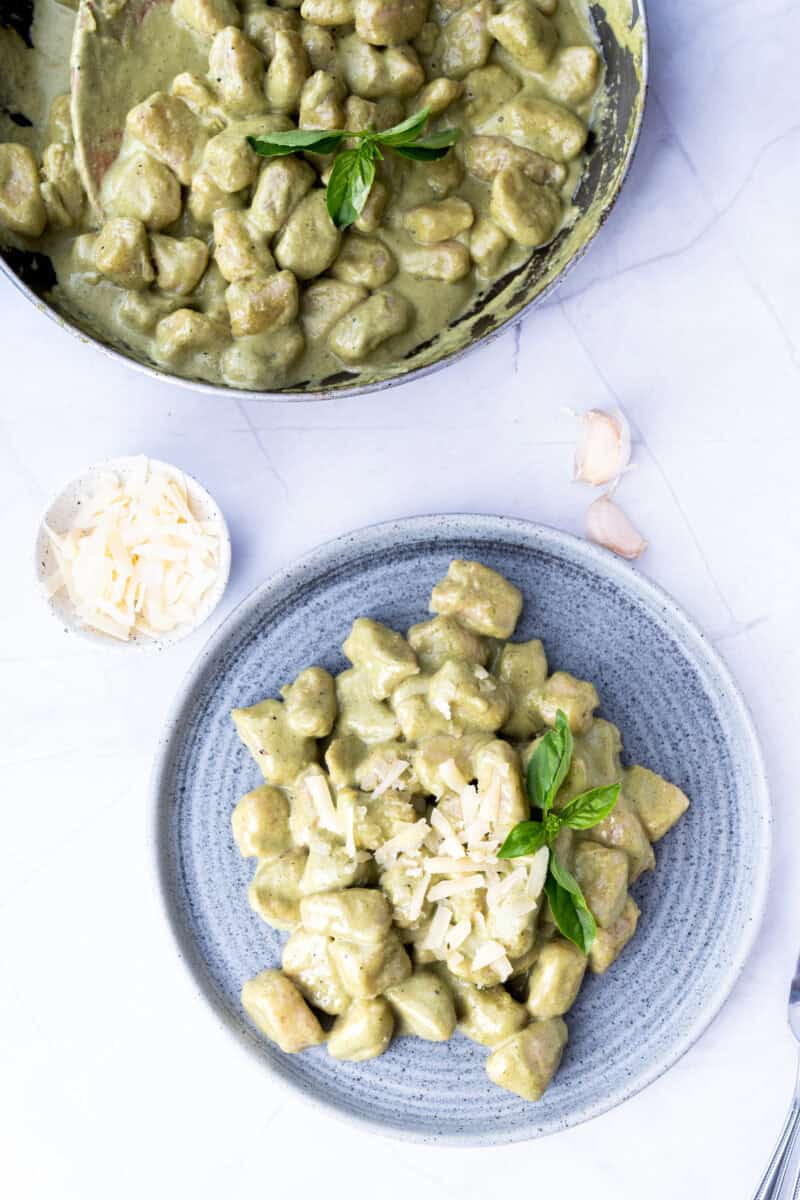 Overheard of potato gnocchi served on a blue plate